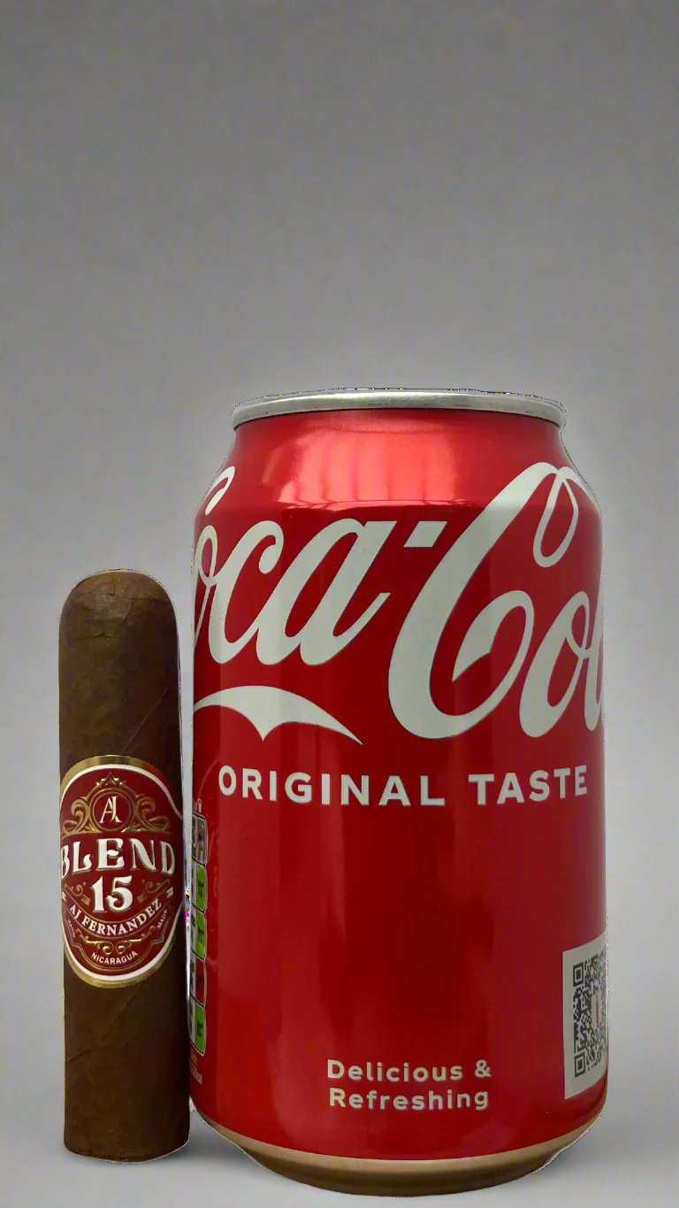 A Single Blend 15 Short Robusto cigar against a can of cola to show scale