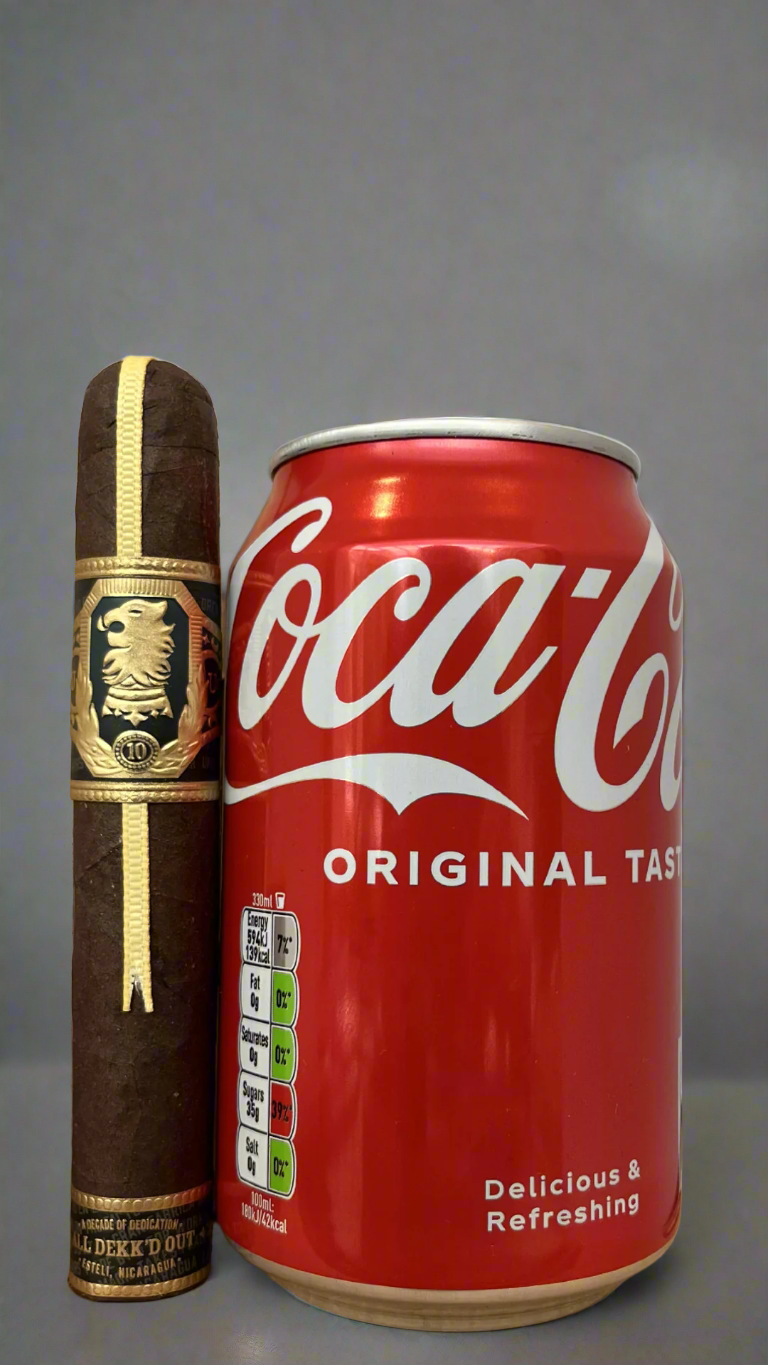A Drew Estate Undercrown 10 Robusto cigar next to a can of coca cola, the cigar is slightly longer than the can.
