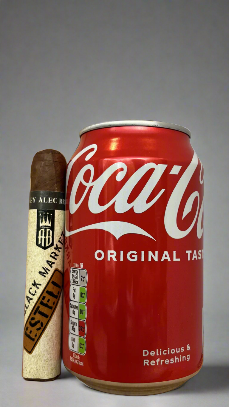 A single Alec Bradley Black Market Punk Esteli Cigar next to a can of coca cola to show scale, they are roughly the same length.