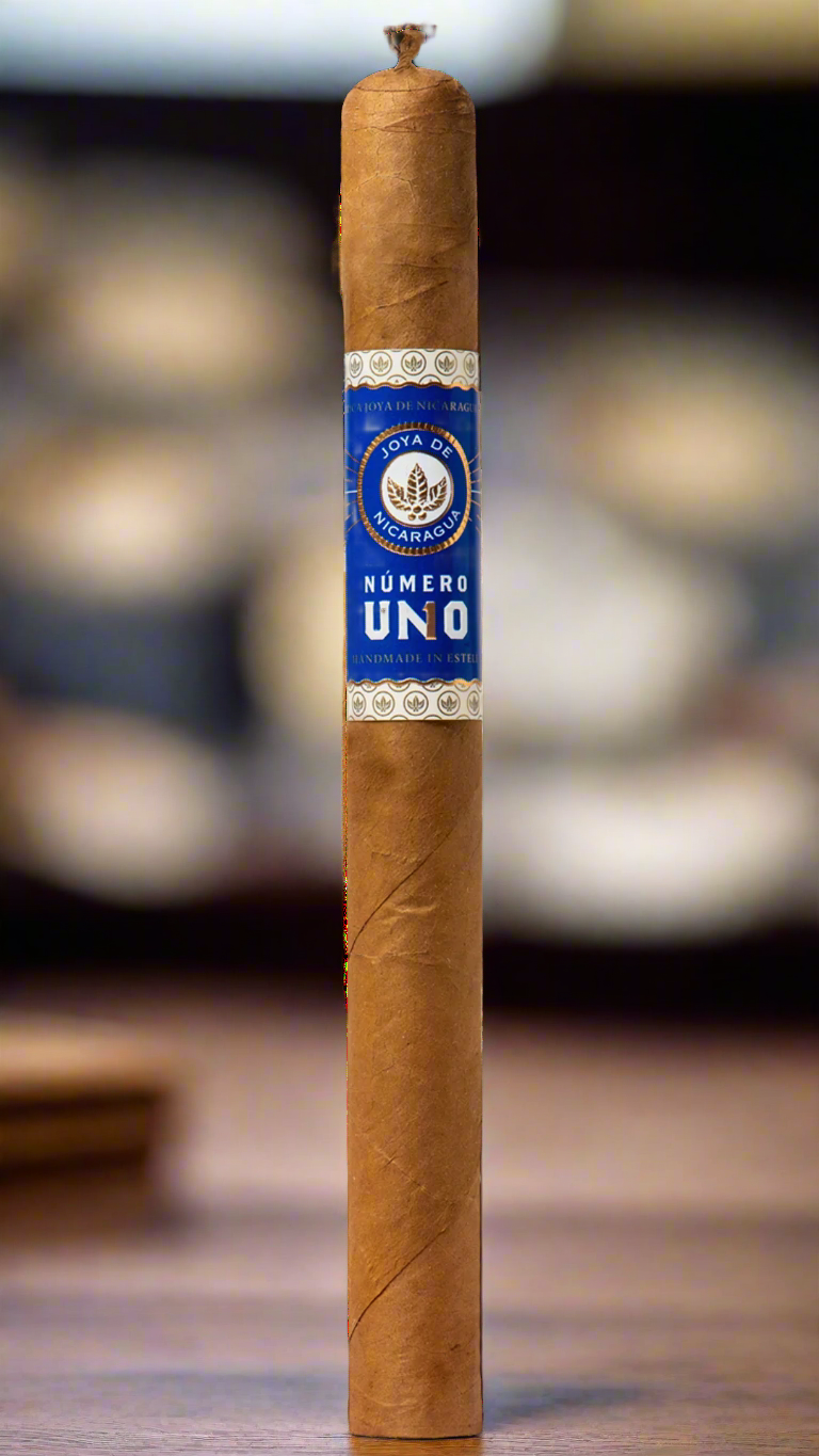 A single Joya De Nicaragua Numero Uno L'ambassadeur cigar in a cigar shop.