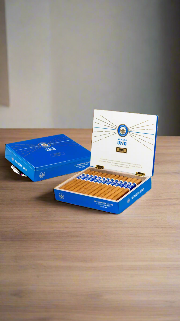 A box of Joya De Nicaragua Numero Uno L'ambassadeur cigars in a diplomatic office.