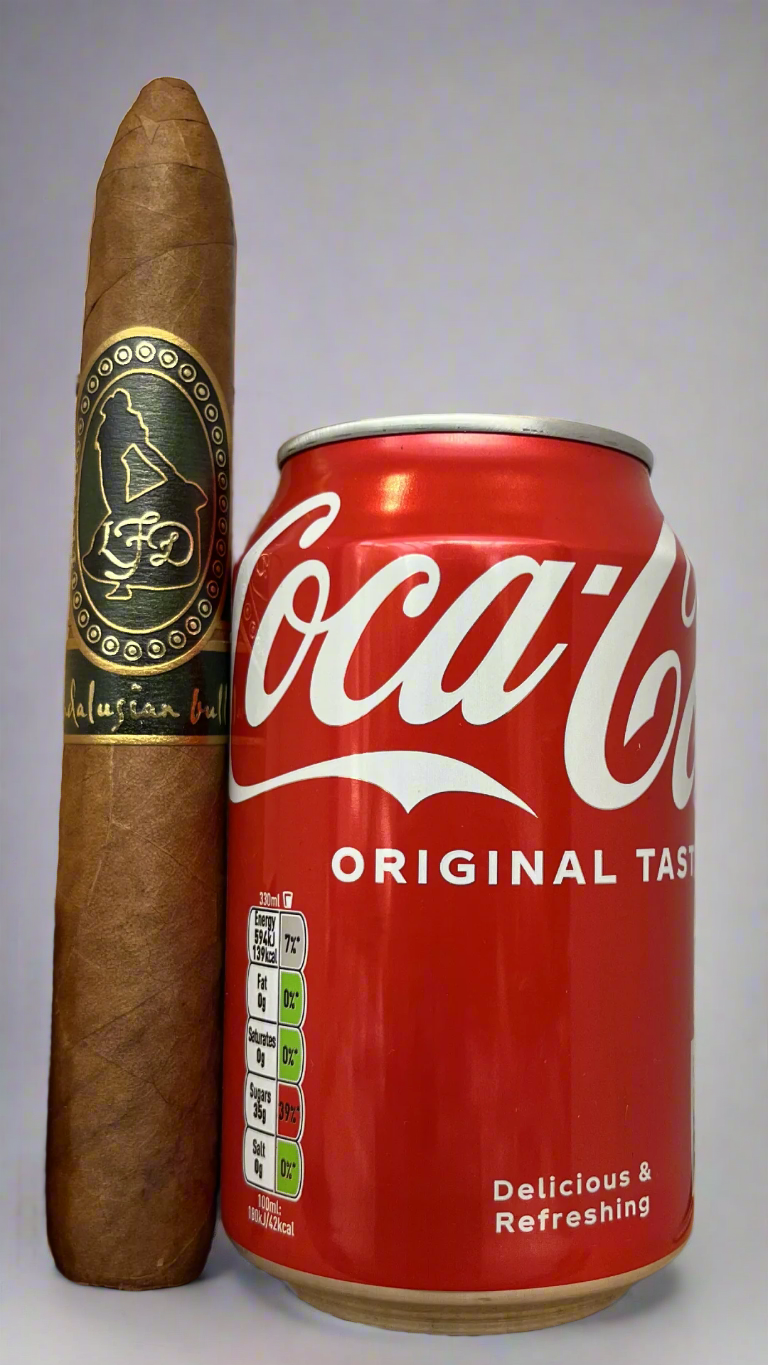 A single La Flor Dominicana Andalusian Bull cigar next to a can of coca cola to show scale, this cigar is about 30% longer than the can.