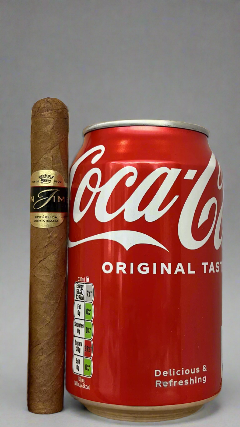 A single Leon Jimenes Prestige Corona Tubos cigar next to a can of coca cola to show scale, the cigar is a few centimetres longer than the can.