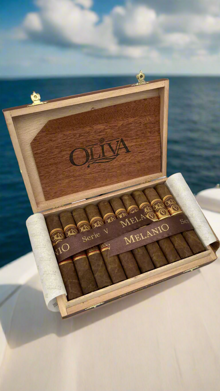 A box of Oliva Serie V Melanio Robusto cigar on a yacht.
