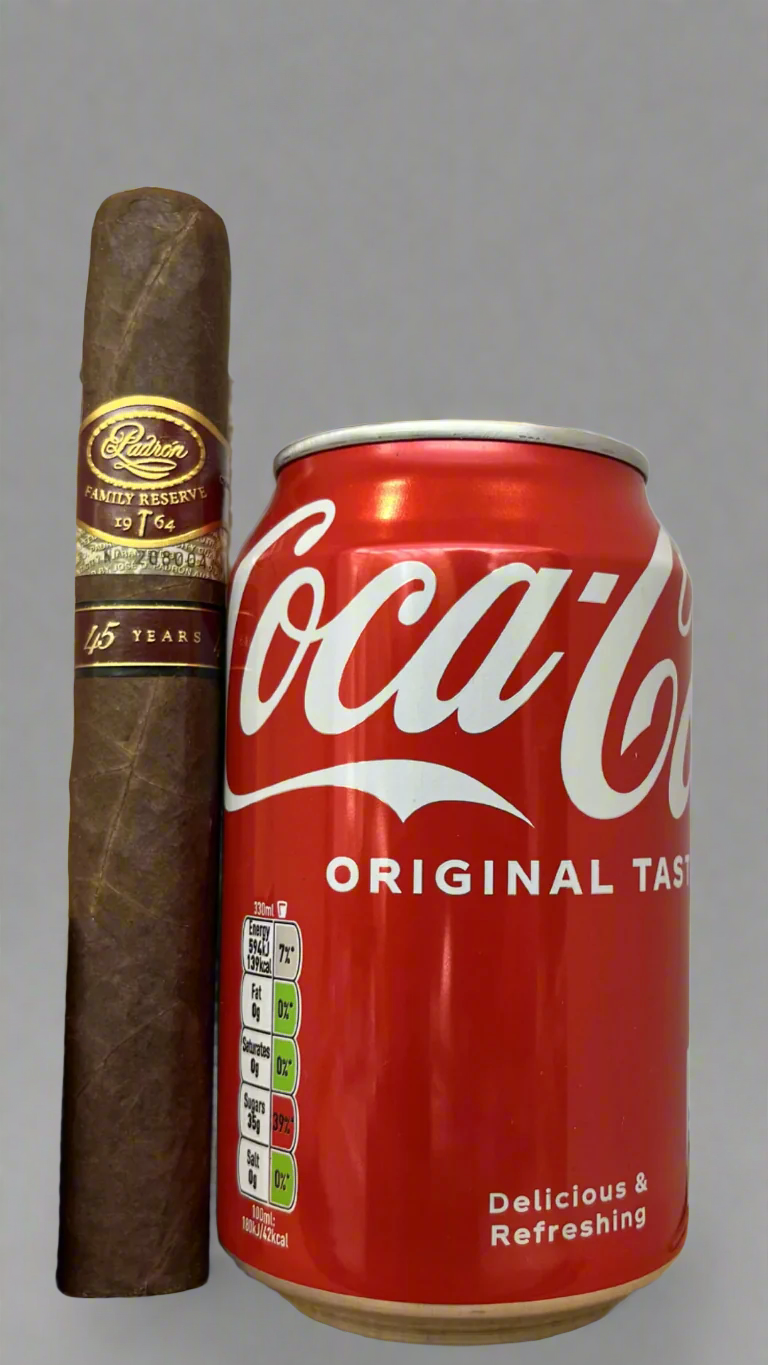 A single Padron No. 45 Family Reserve Maduro cigar next to a can of coca cola to show scale, the cigar is about 20% longer than the can