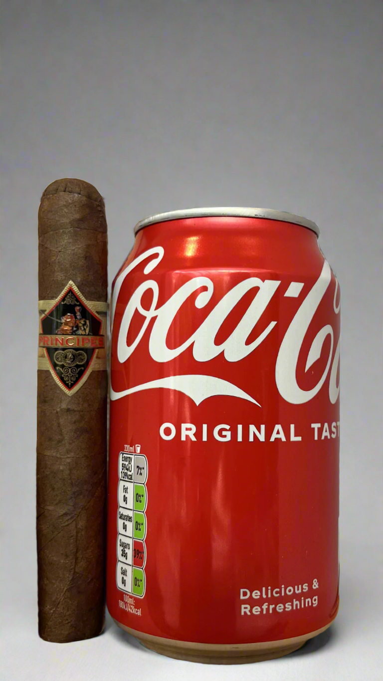 A single Principes Long Filler Maduro Robusto cigar next to a can of coca cola to show scale, the cigar is a few centimetres longer than the can.