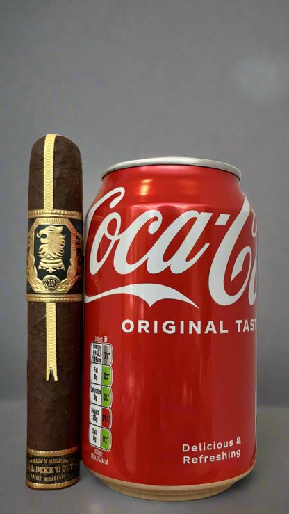 A Drew Estate Undercrown 10 Robusto cigar next to a can of coca cola, the cigar is slightly longer than the can.