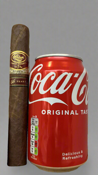 A single Padron No. 45 Family Reserve Maduro cigar next to a can of coca cola to show scale, the cigar is about 20% longer than the can 